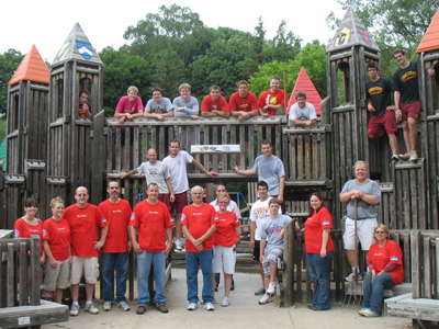 Ferris State men's ice hockey and football student-athletes  along with Big Rapids High School hockey players assisted in the Playscape landscaping project. (Photo by Terri Hook)