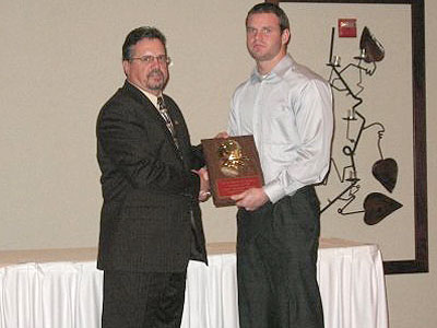 FSU head coach Jeff Pierce (left) congratulates 2009 team MVP Matt Ryan (right) - Courtesy Photo