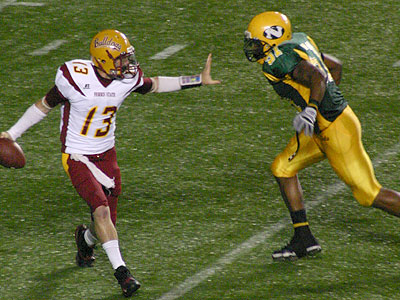 FSU's Kyle Parrish is pressured in Saturday's road loss (Photo by Sandy Gholston)