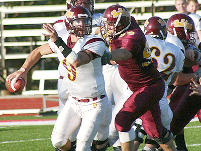 FSU quarterback Tom Schneider attempts to pass in last year's Crimson & Gold Spring Game (Photo by Sandy Gholston)