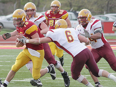 FSU quarterback Robert Banaszak runs with the ball in Friday's spring game (Photo courtesy Zeke Jennings/Big Rapids Pioneer)