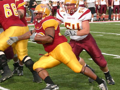 Senior Leon Curry carries the ball in Friday's spring game (Photo by Sandy Gholston)