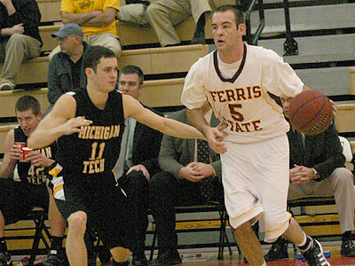 FSU's Matt DeHart works against MTU's Erik Stephens (Photo by Sandy Gholston)