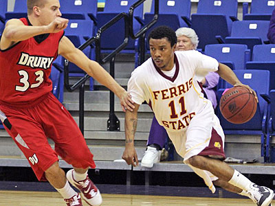 Senior Darien Gay drives by a Drury defender in Friday's contest (Photo courtesy Scott Puryear - Drury)