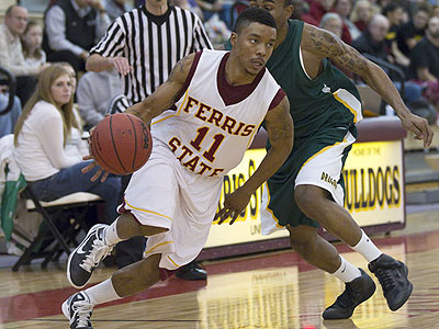 Senior Darien Gay handles the ball in Thursday's league-opening win (Photo by Ben Amato)