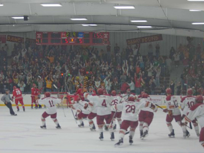 The Bulldogs celebrate the game-winning overtime goal in Saturday's contest.