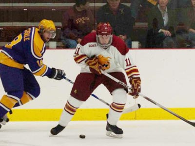 Ferris' Jordie Johnston battles for the puck in Sunday's exhibition game versus Wilfrid Laurier.