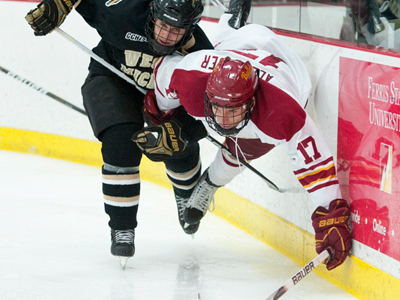 Ferris' Eric Alexander gets tripped up by a Western Michigan skater in Saturday's overtime tie.  (Photo by Ed Hyde)