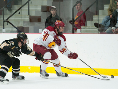 Andy Huff outraces a Western Michigan skater for the puck in Friday's 3-1 home win over the Broncos.  (Photo by Ed Hyde)
