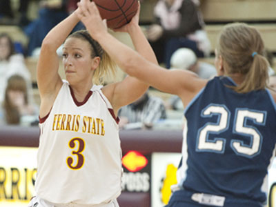 Ferris' Lindsey Pettit looks for an open teammate against Northwood (Photo by Ed Hyde)