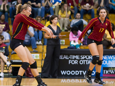 Ashley Huntey (#8) posts one of her match-high tying 17 digs at Grand Valley State as (#17) Aly Brecht looks on.  (Photo by Ben Amato)