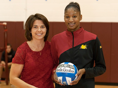 Head coach Tia Brandel-Wilhelm honors Arielle Goodson's 1,000th career kill prior to Saturday's match.  (Photo by Ben Amato)