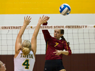 Ferris' Anne Sutton posts one of her 11 kills in Saturday's come-from-behind win over Tiffin.  (Photo by Ben Amato)